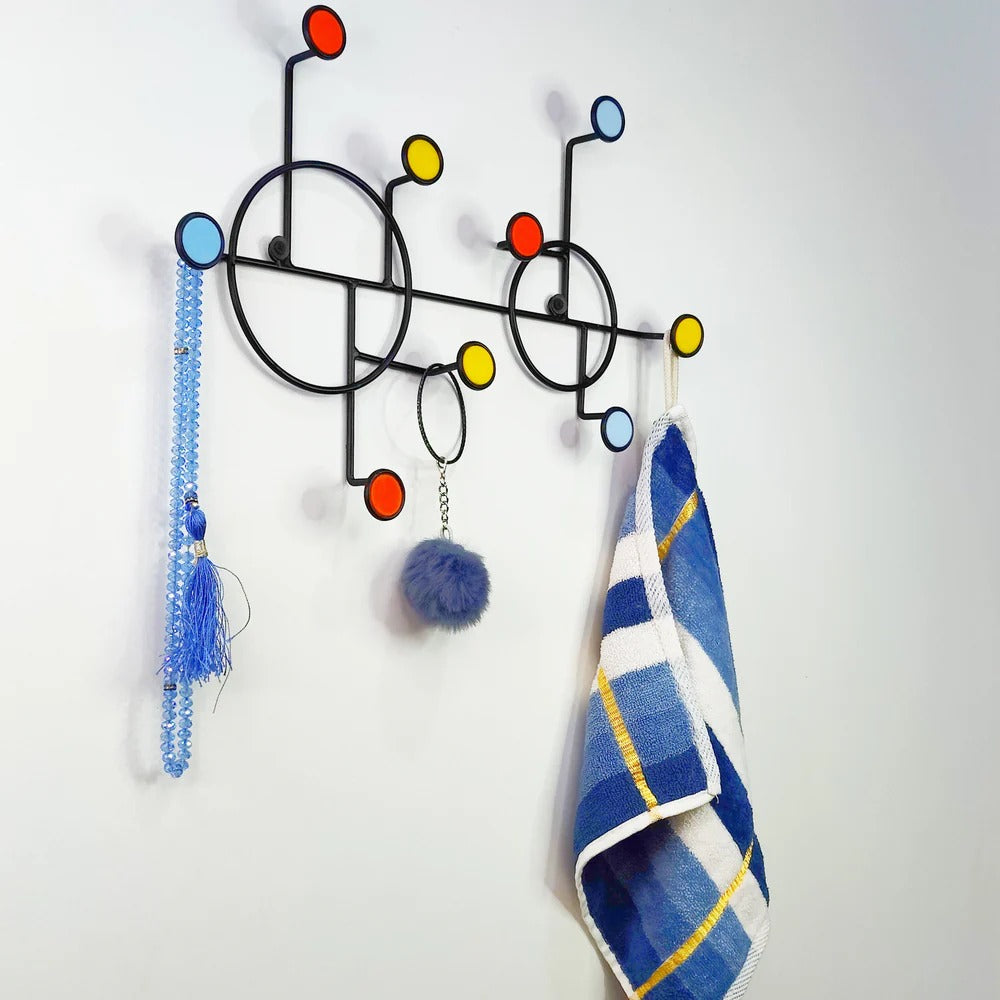 Circular Nordic wall shelf styled in an entryway with hanging keys and décor