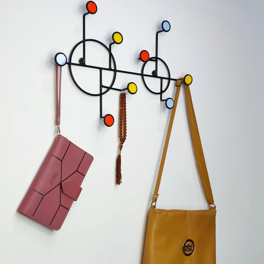 Minimalist round wall shelf with hooks, shown empty against a neutral wall