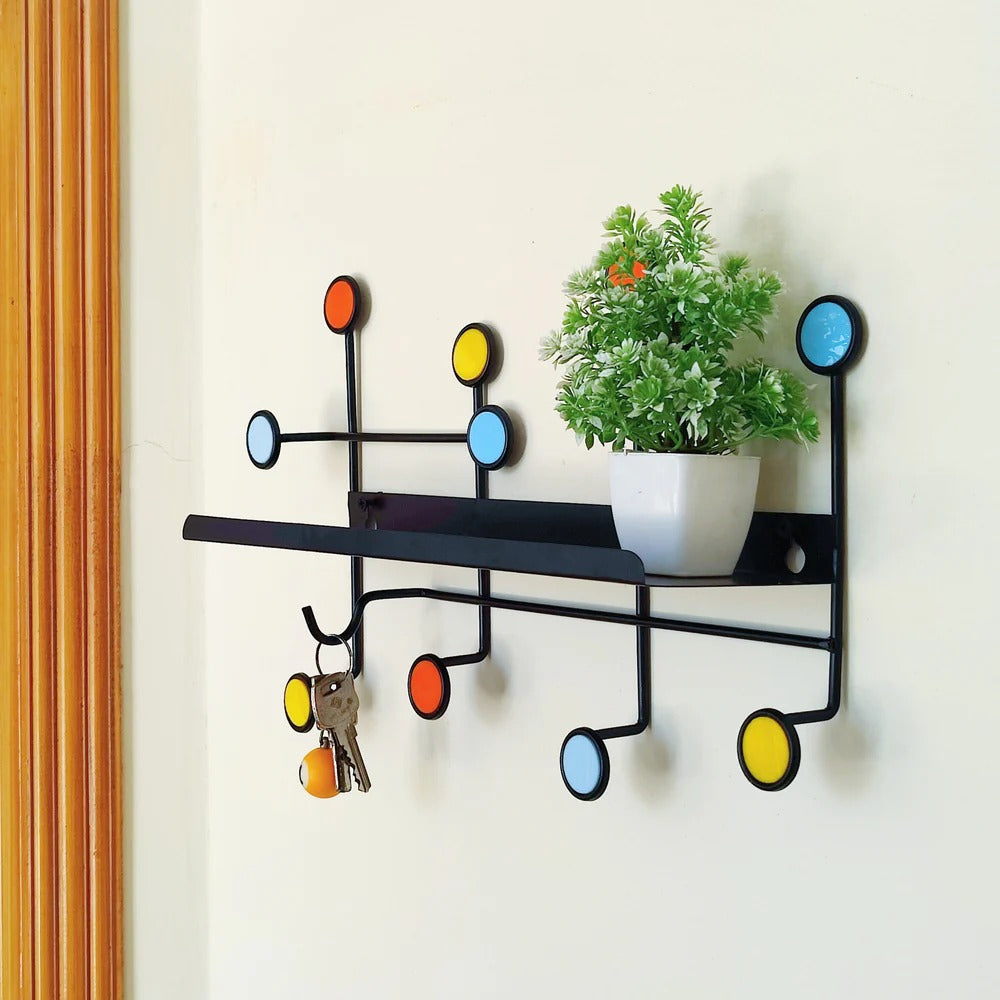 Nordic wall shelf styled in an entryway with keys, hat, and decor items