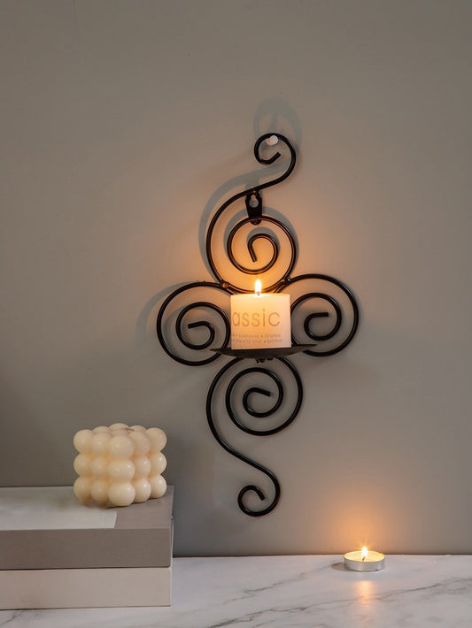 Wall-mounted black metal candle holder with elegant swirl design – ruhdecor

